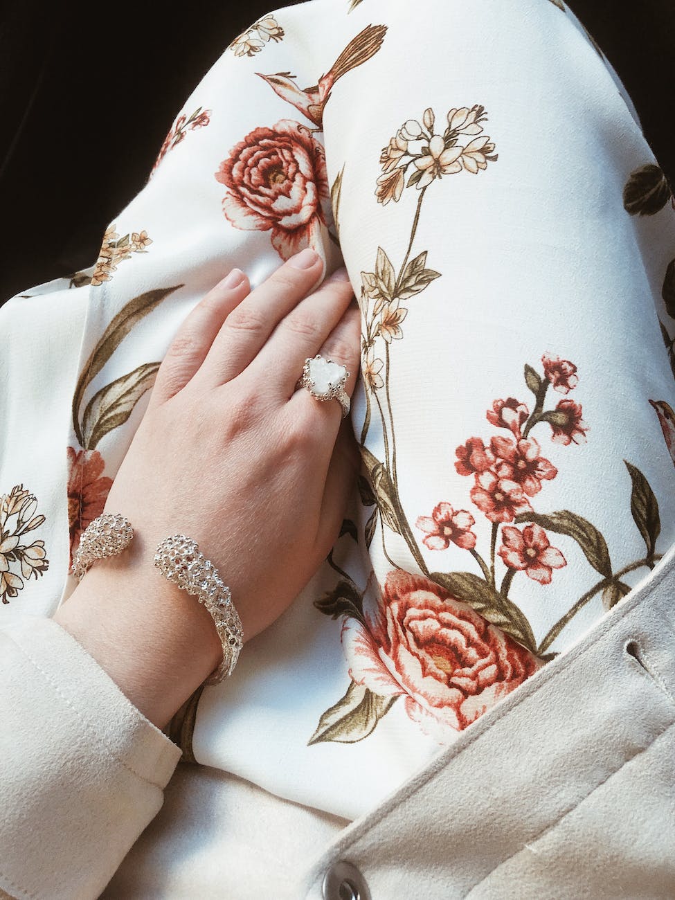 silver colored ring and bracelet