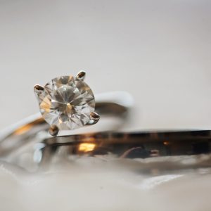 close up photo of diamond stud silver colored eternity ring